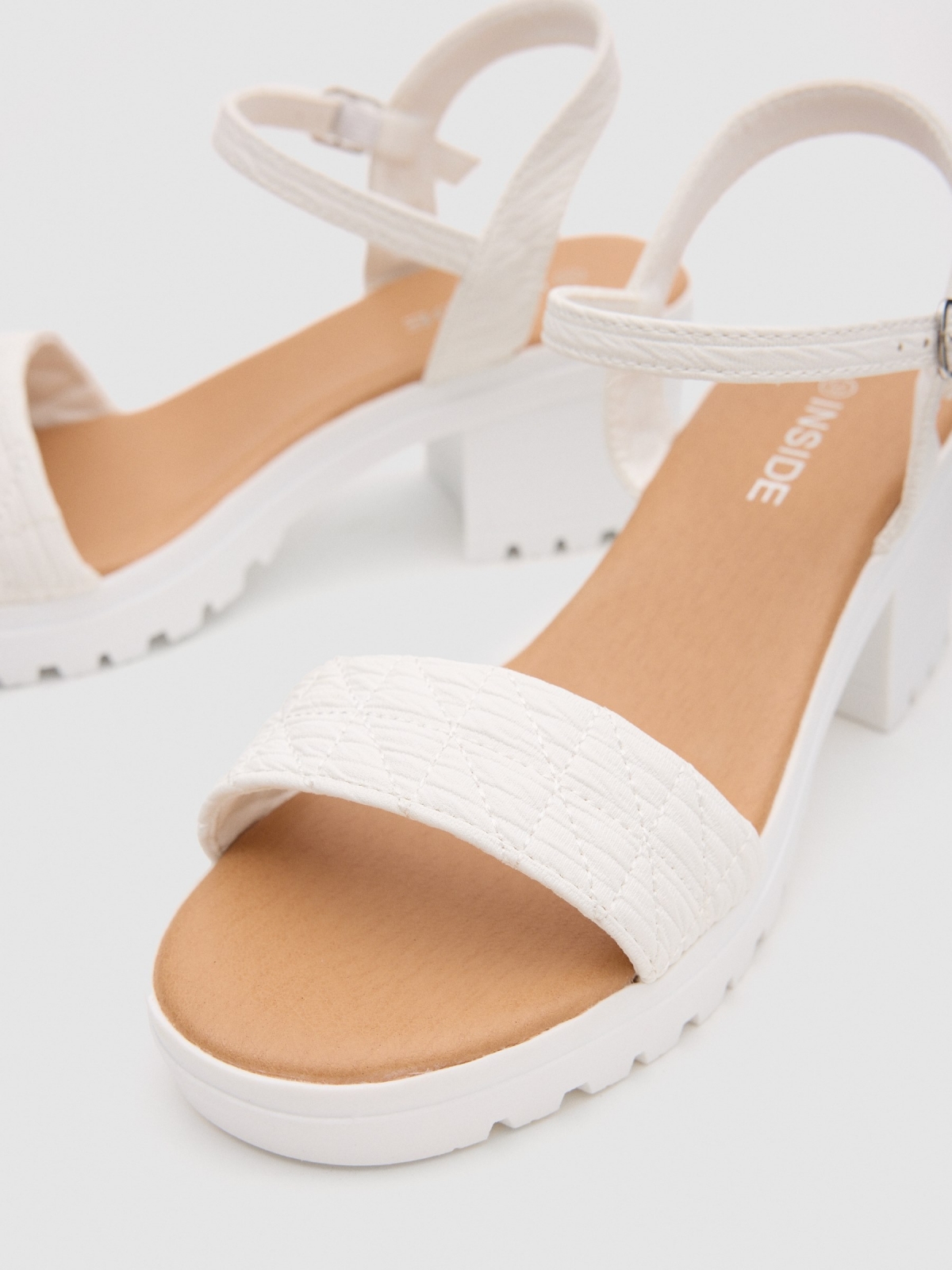 Track heel sandal white detail view