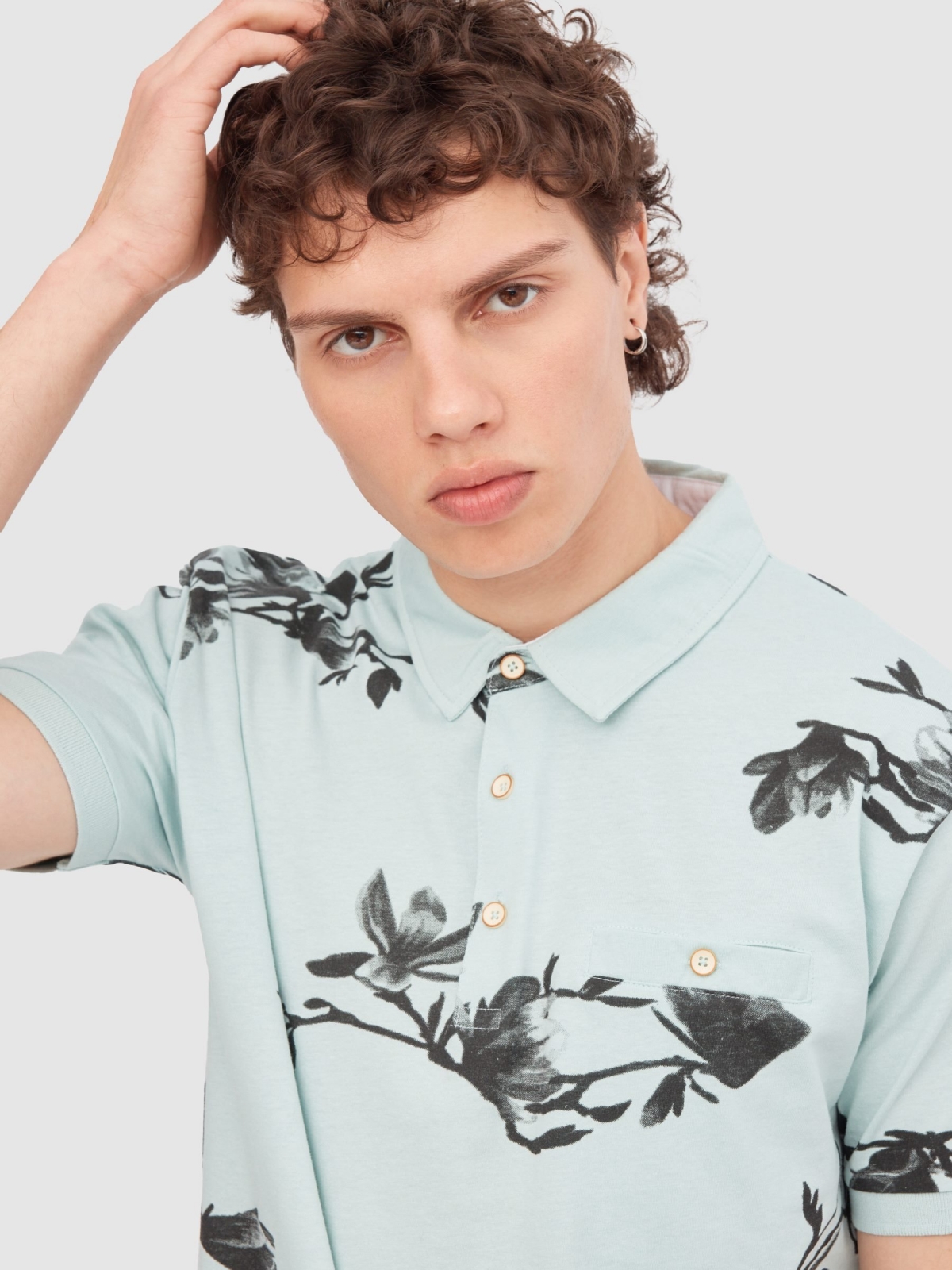 Flower print polo green detail view