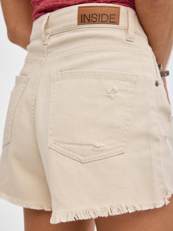 Flared shorts sand detail view