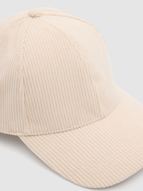 White fabric cap off white detail view