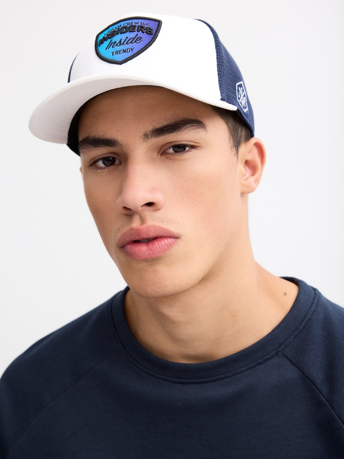 Two-tone Insiders Cap white with a model