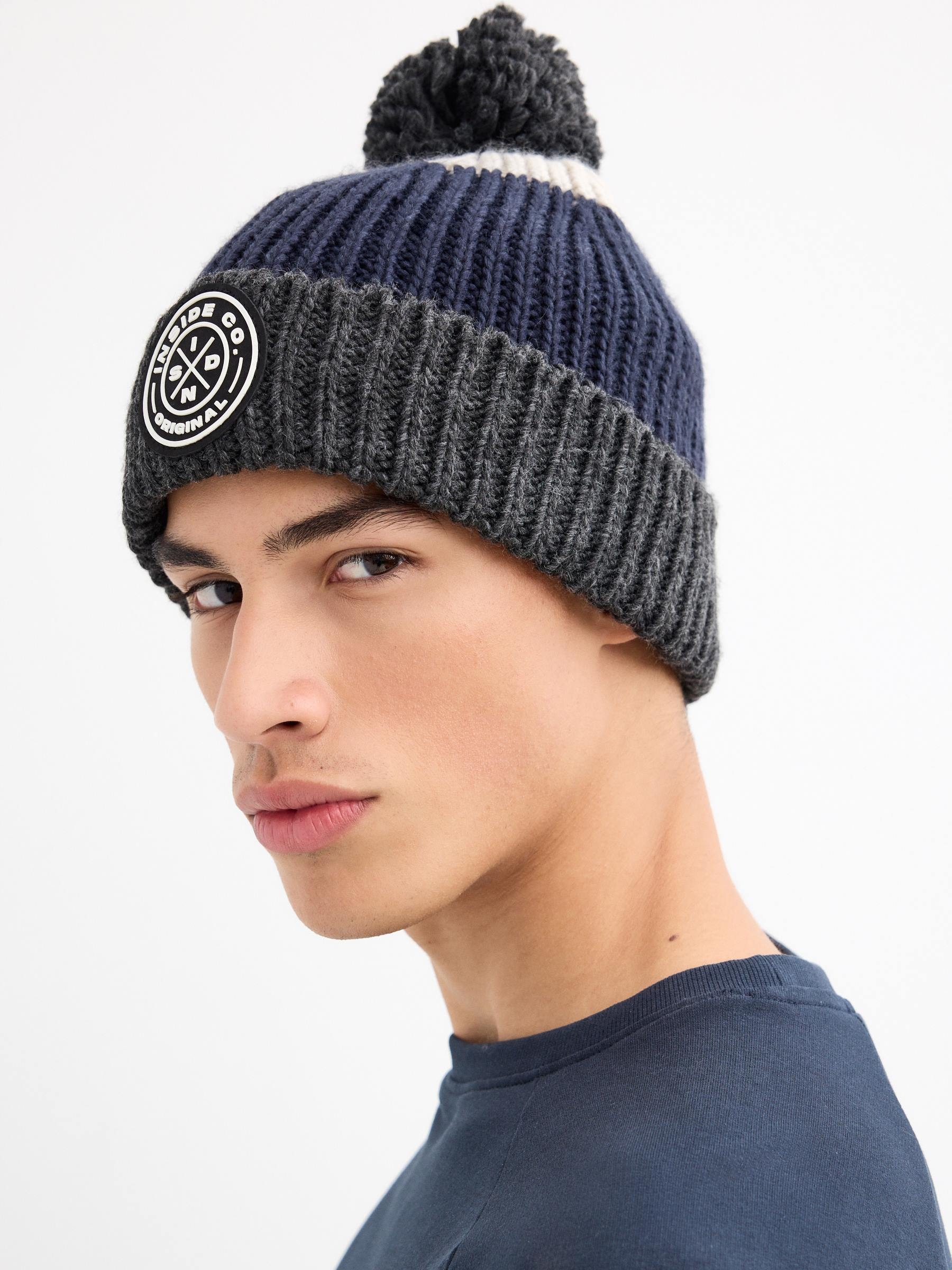 Multicolored pom-pom hat blue 45º front view