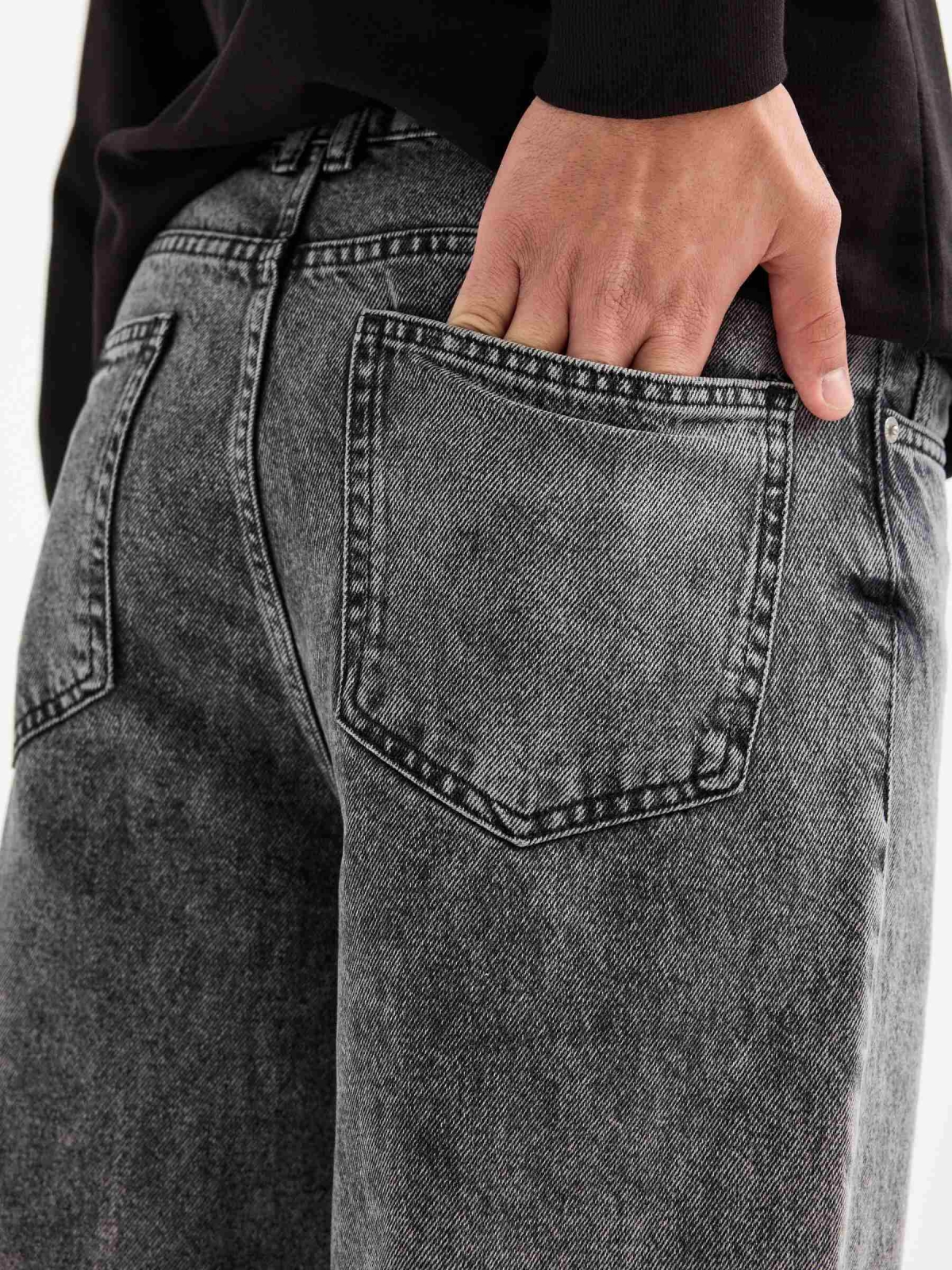 Worn grey baggy jeans grey detail view