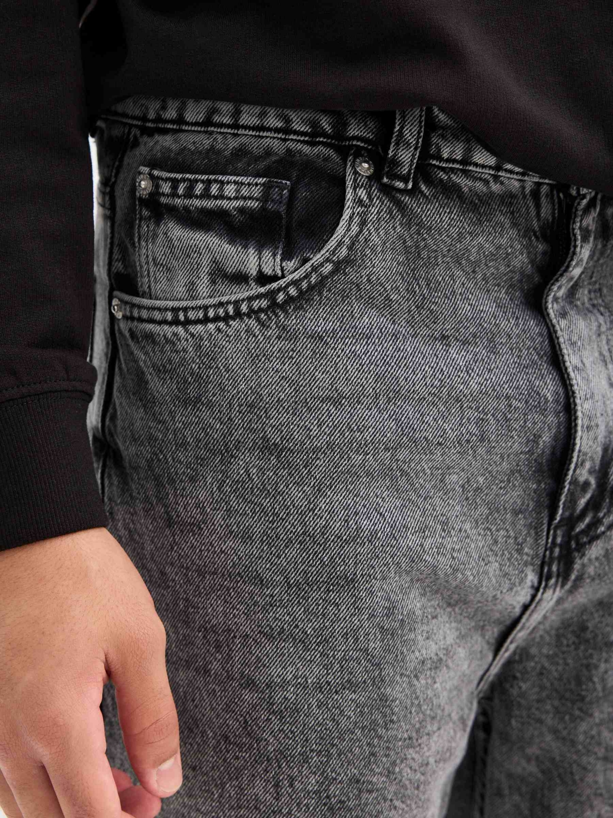 Worn grey baggy jeans grey detail view