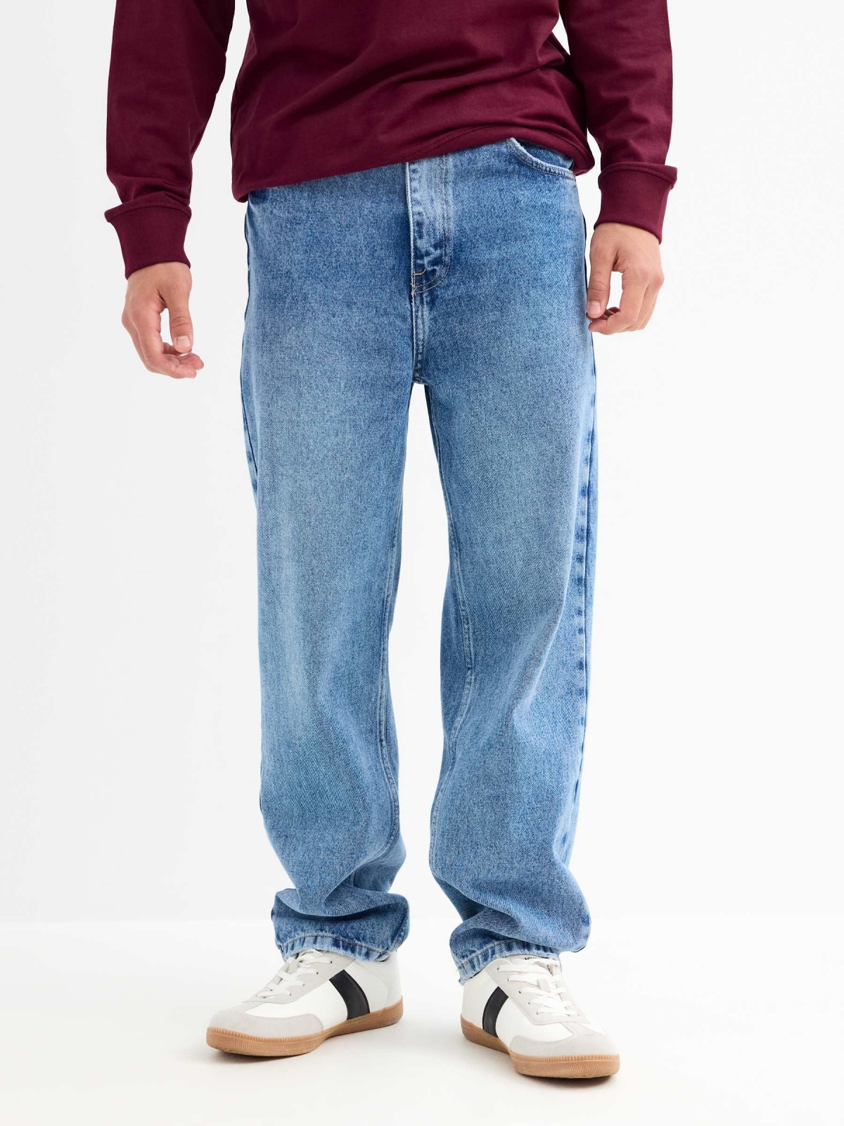 Blue baggy jeans with frayed blue middle front view