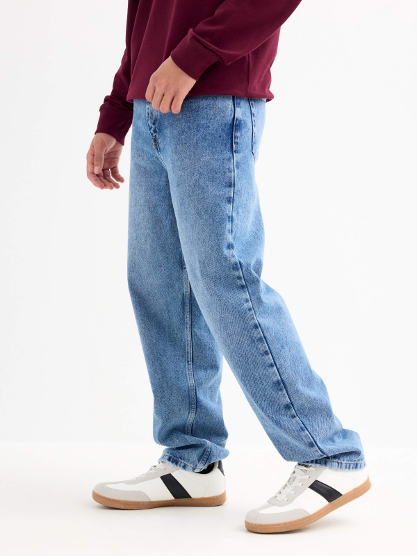 Blue baggy jeans with frayed blue detail view