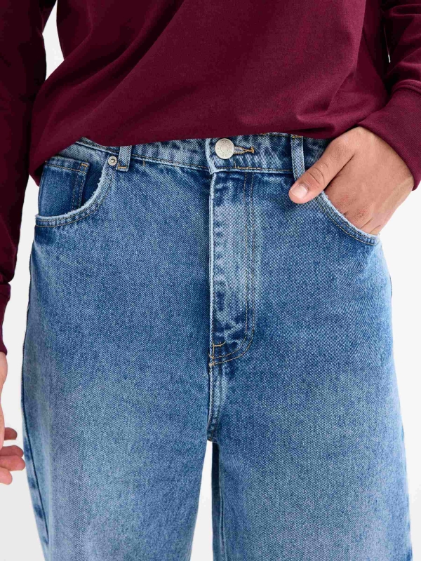 Blue baggy jeans with frayed blue detail view