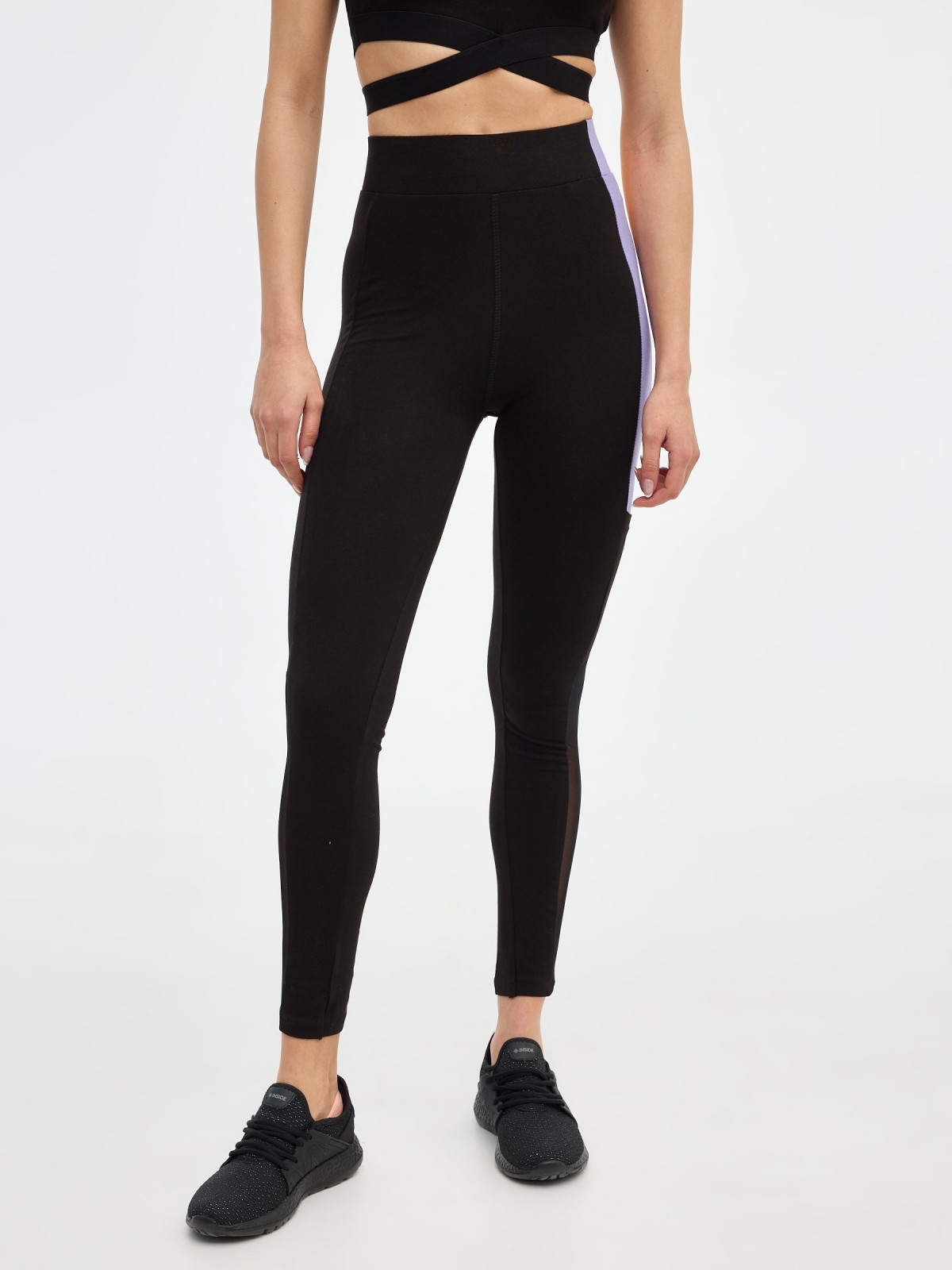 Legging color block lila negro vista media trasera