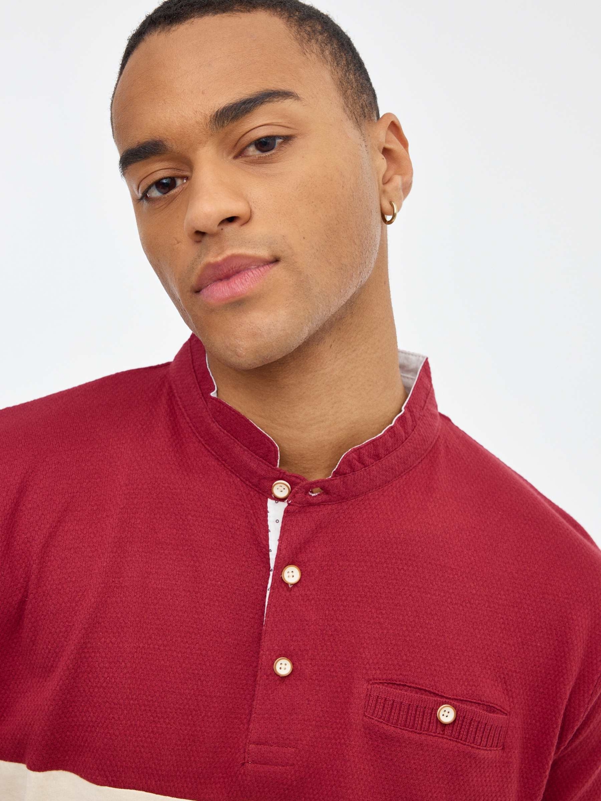 Maroon mao polo shirt sand detail view