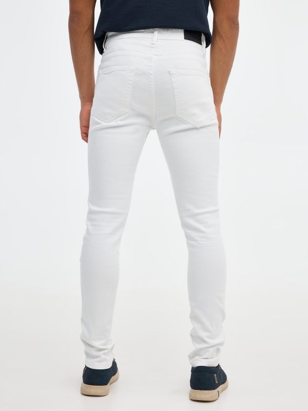 White skinny jeans white front view