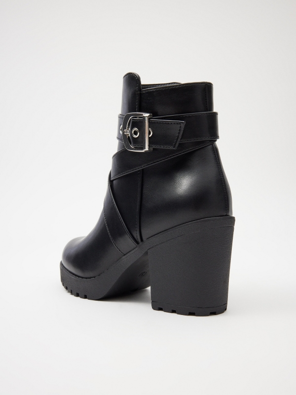 Heeled ankle boots with buckle detail view