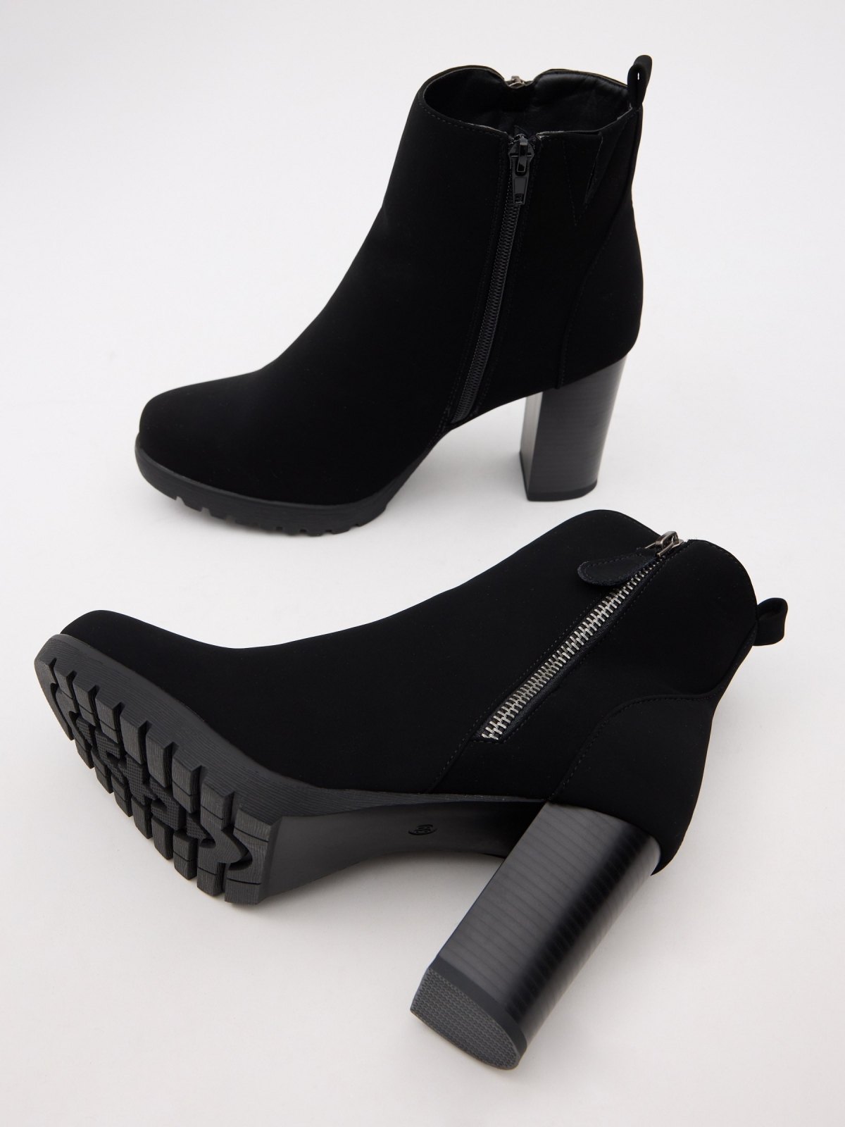 Modern heeled ankle boots black detail view