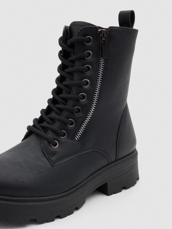 Black military boot with track sole black detail view