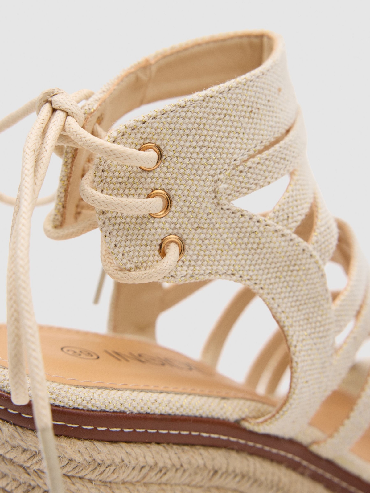 Wedge Roman straps off white detail view