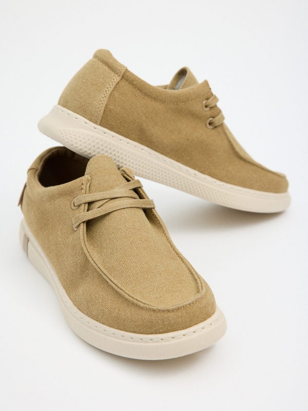 Canvas wallabee shoe sand detail view