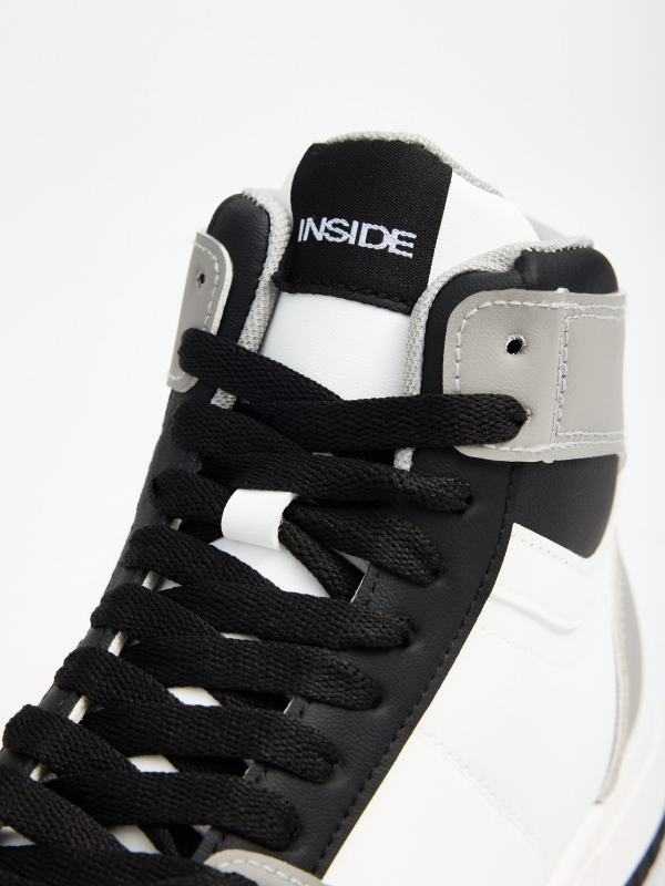 Trainer black and white sports boot white detail view