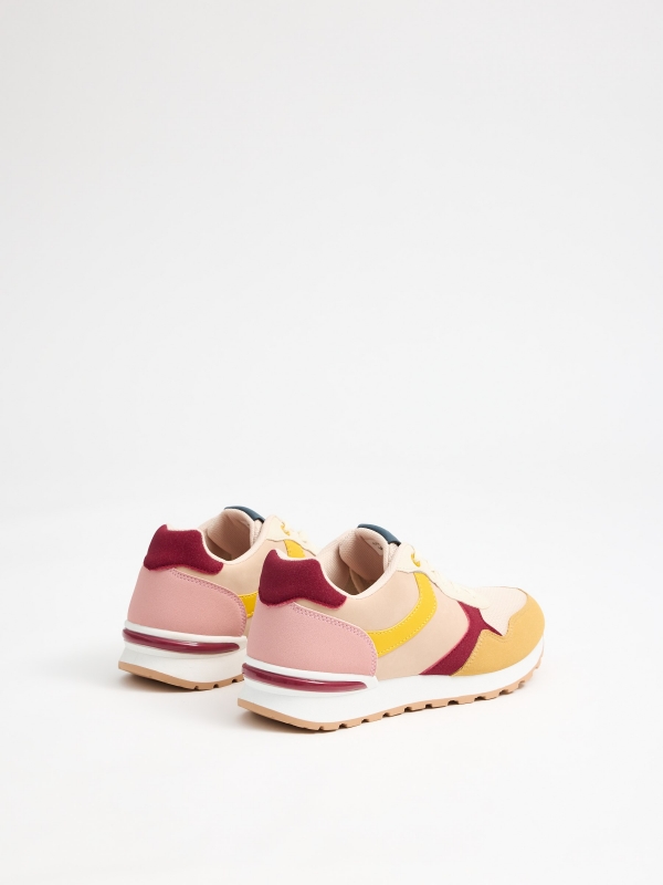 Multi-piece combination sports shoe pastel yellow 45º front view