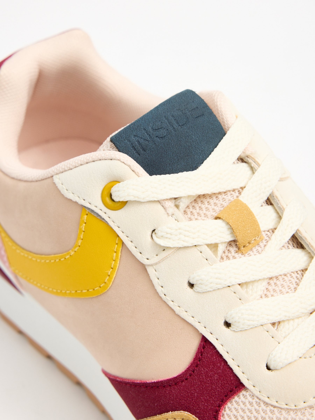 Multi-piece combination sports shoe pastel yellow detail view