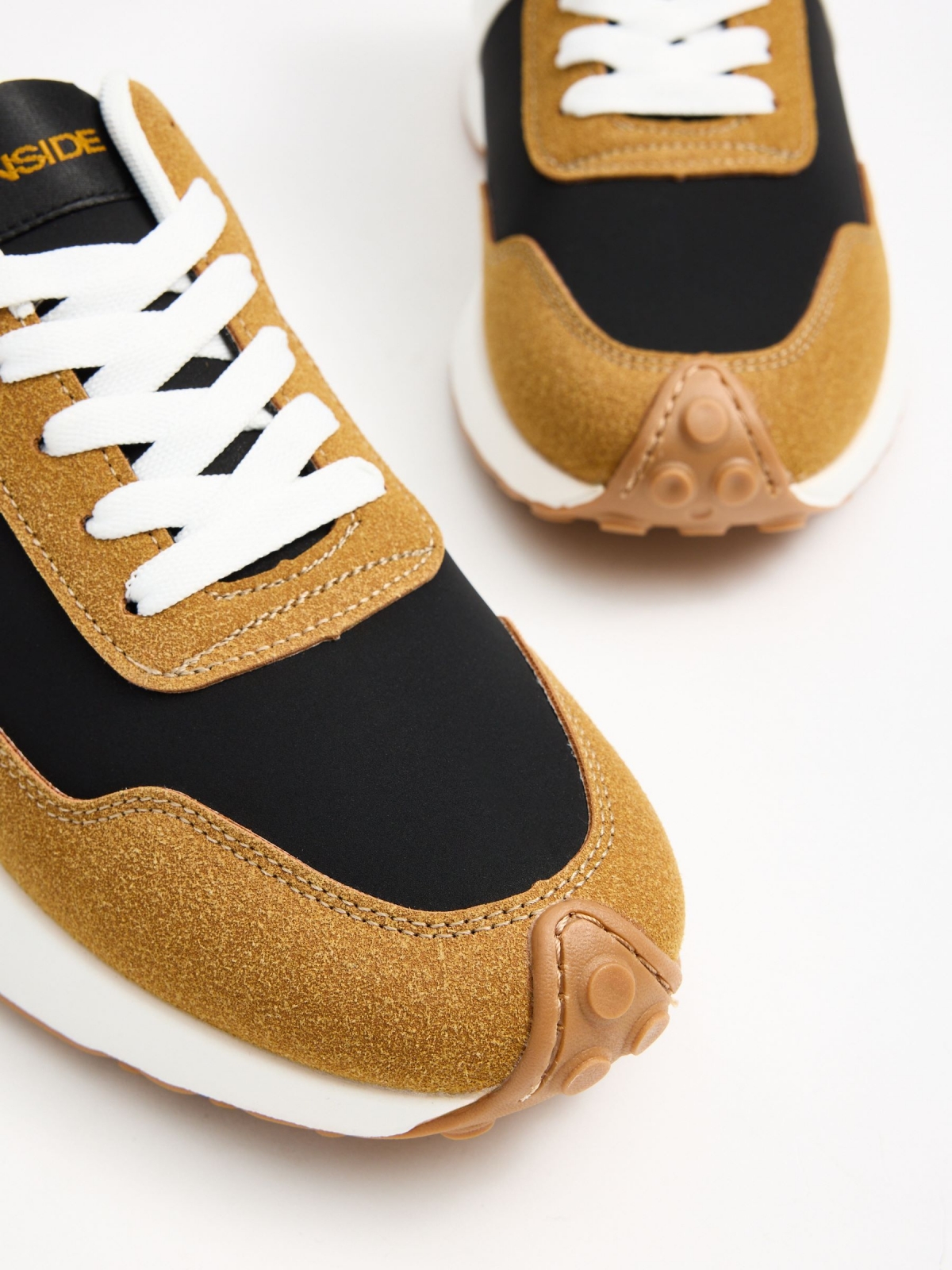 Mustard combination sneaker black detail view