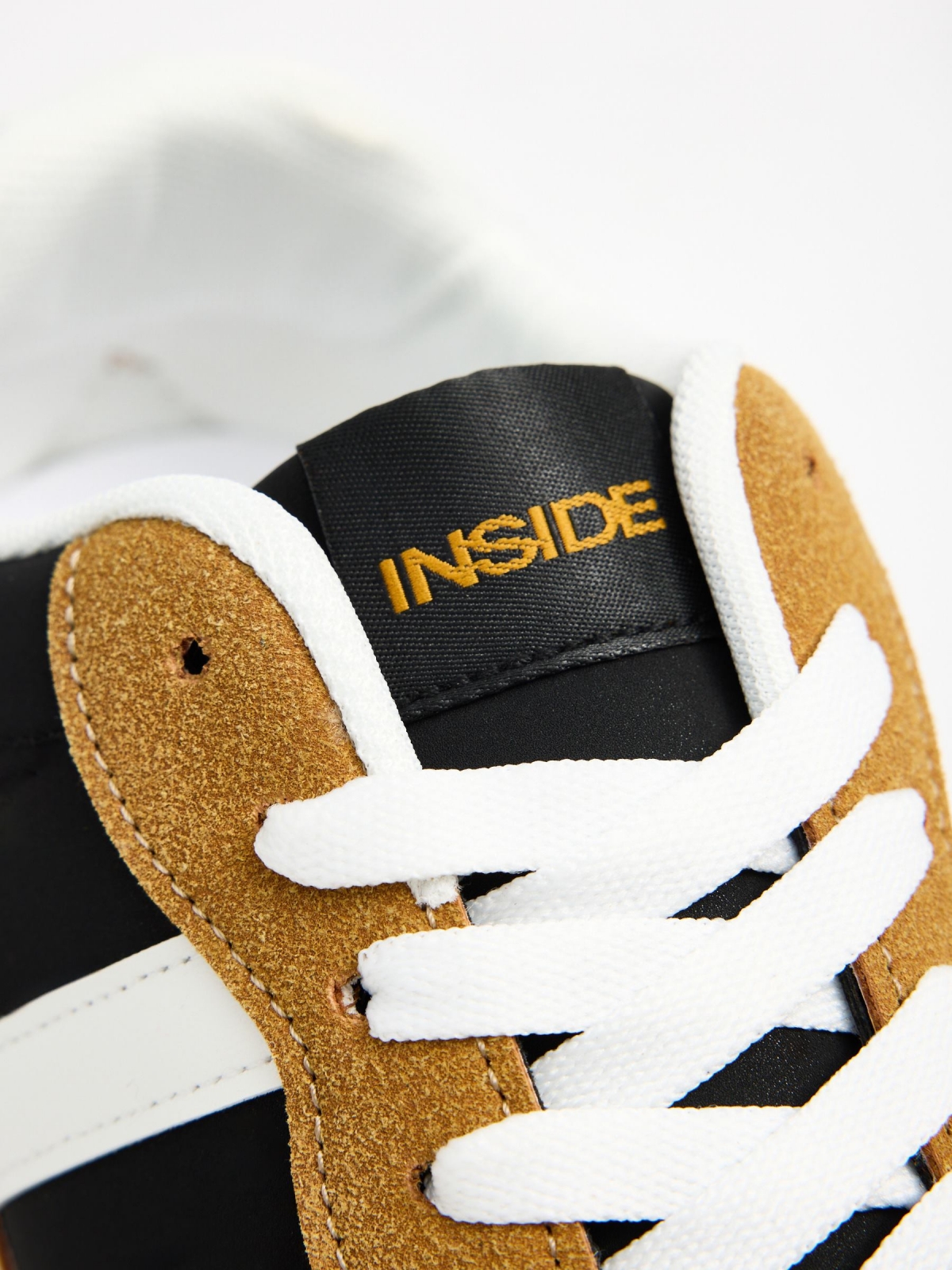 Mustard combination sneaker black detail view