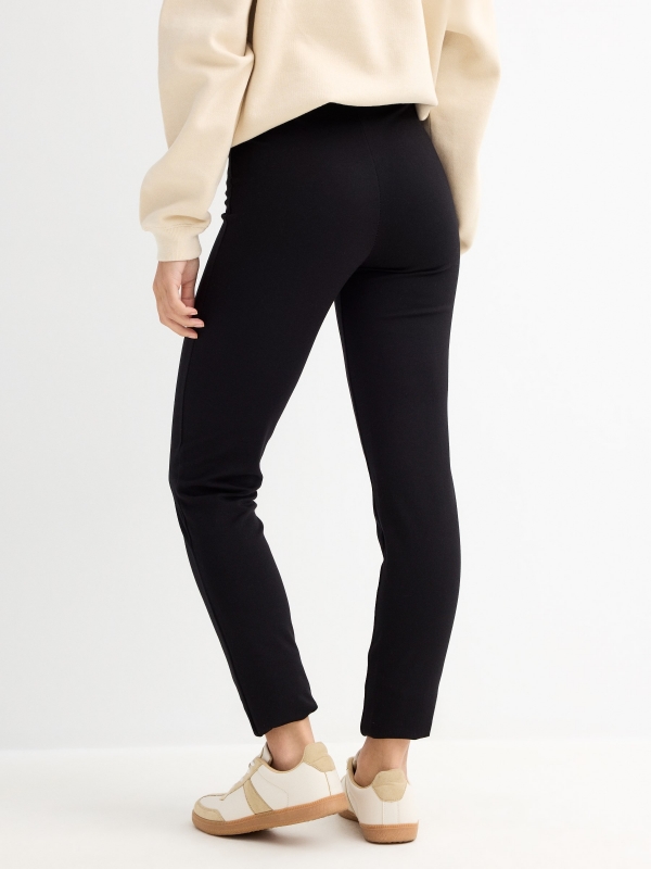 Knitted leggings with black slit black middle back view