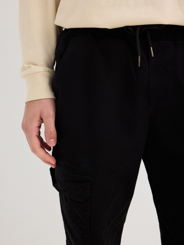 Black sport jogger trousers grey detail view