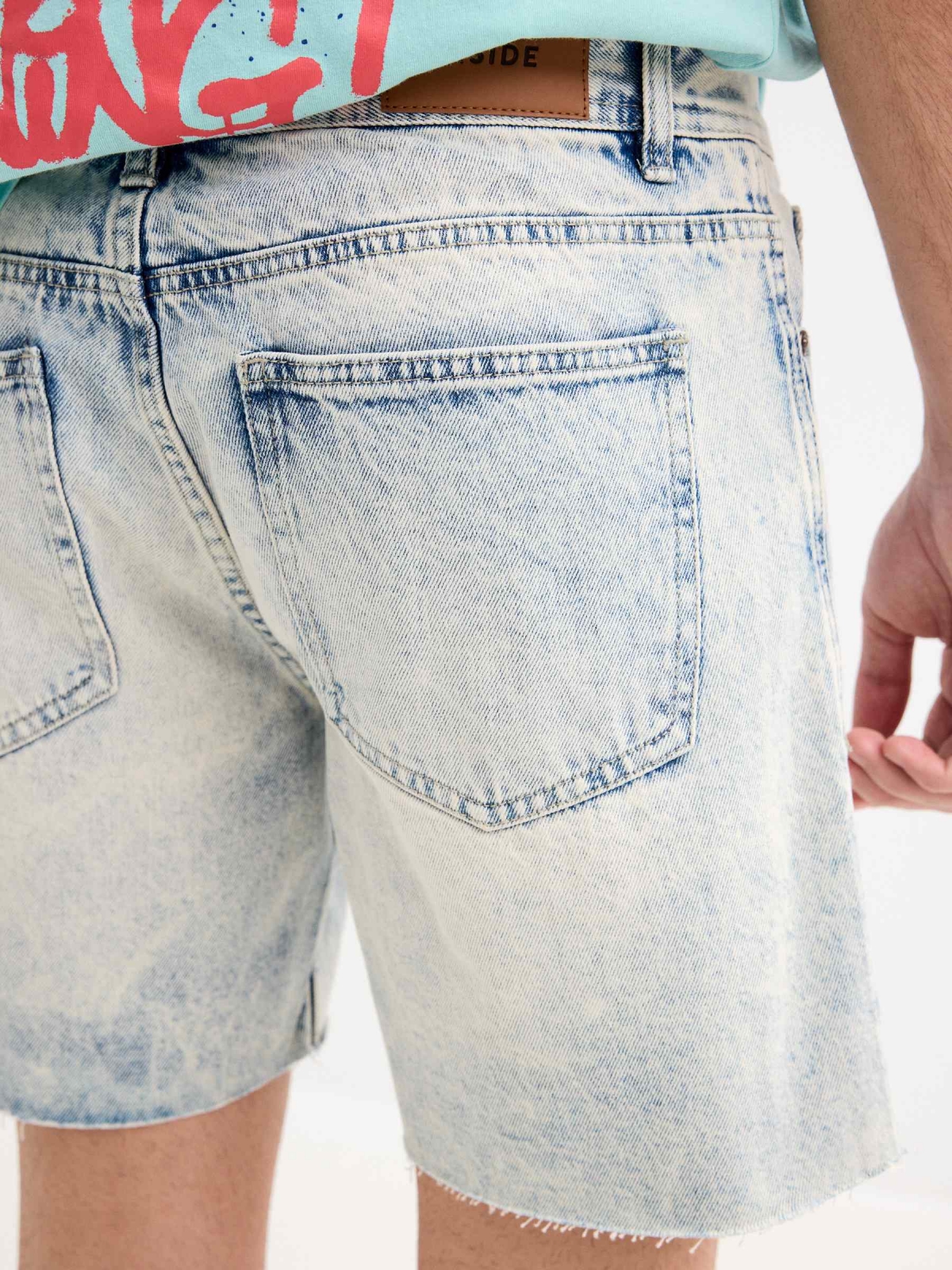 Frayed hem denim Bermuda shorts light blue back detail view