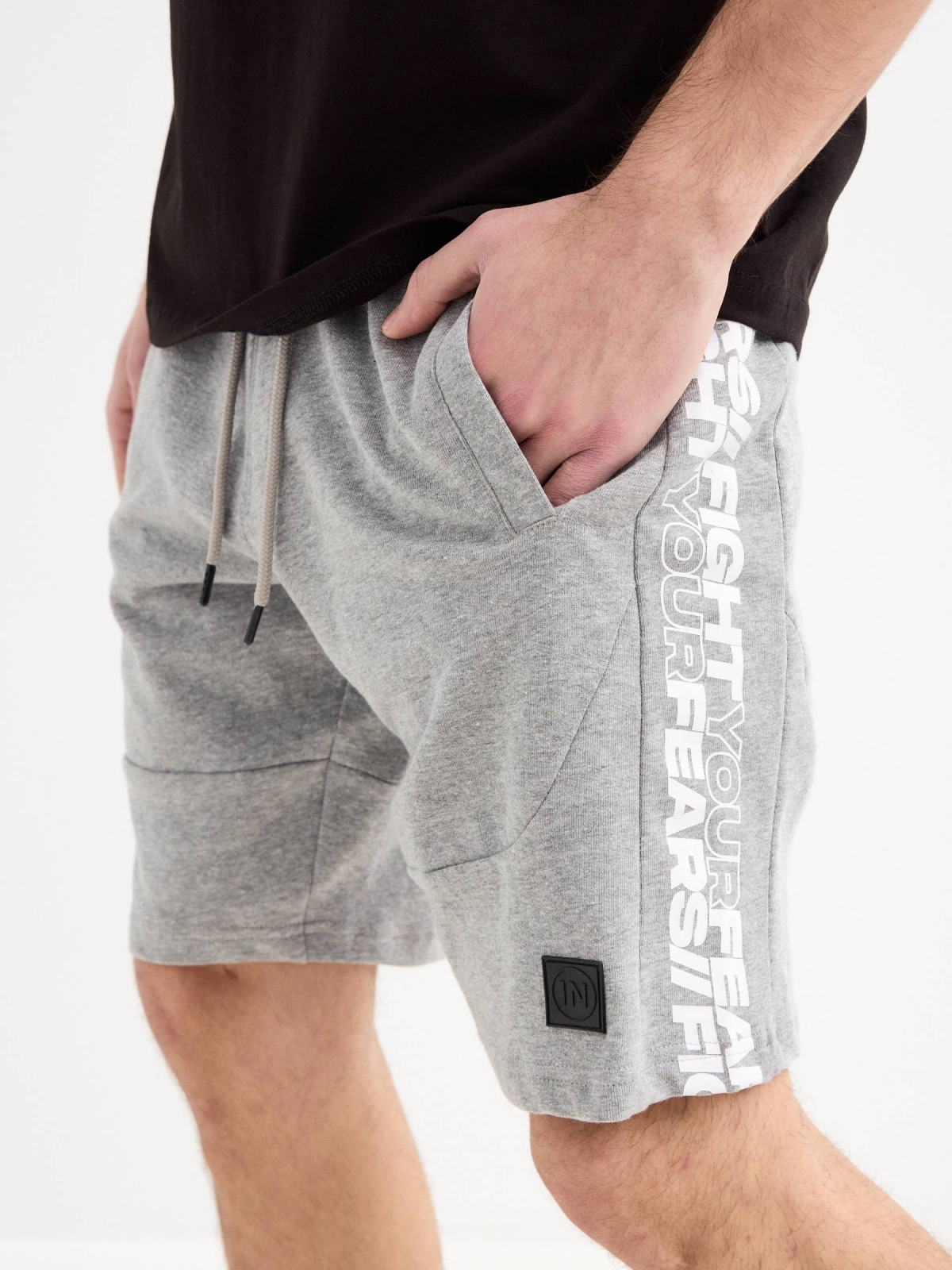 Bermuda jogger shorts with text grey front detail view