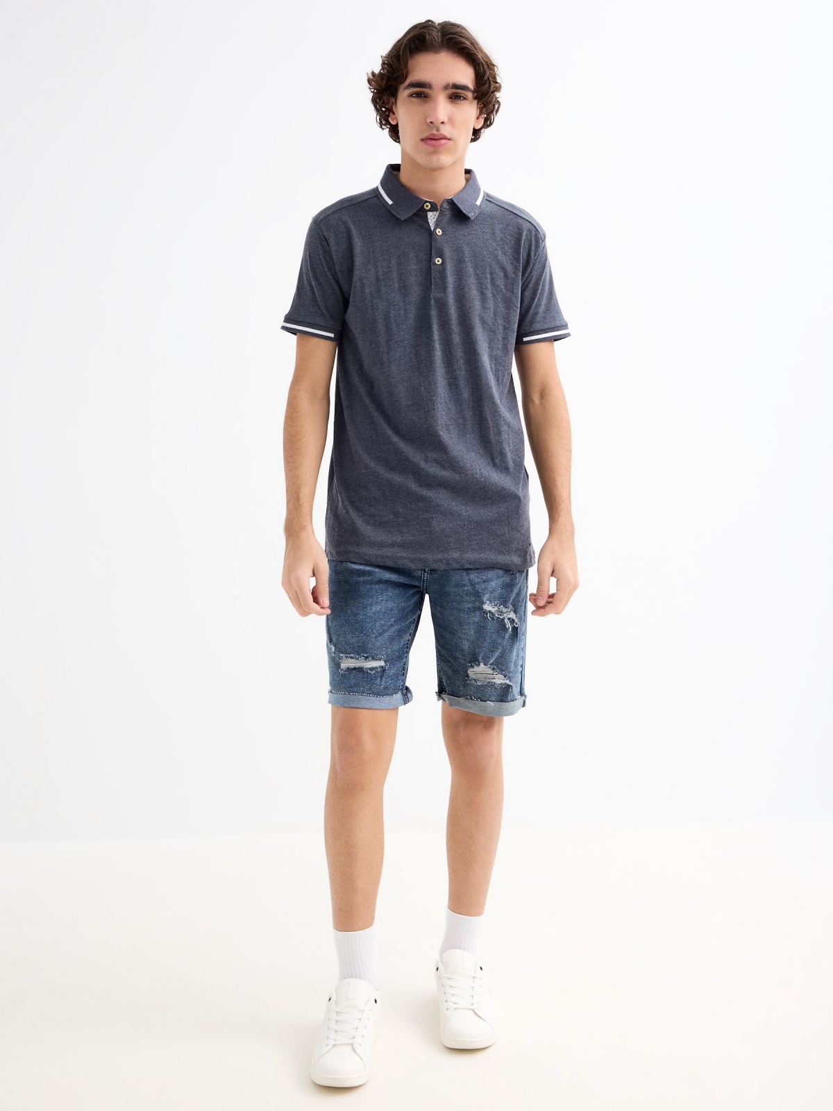 Ripped slim denim Bermuda shorts blue general front view