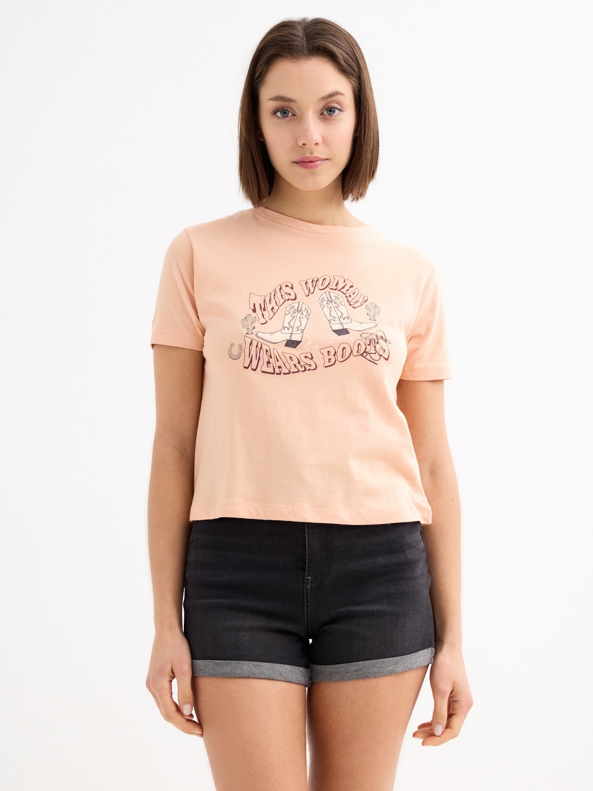 Wears Boots T-shirt peach middle front view