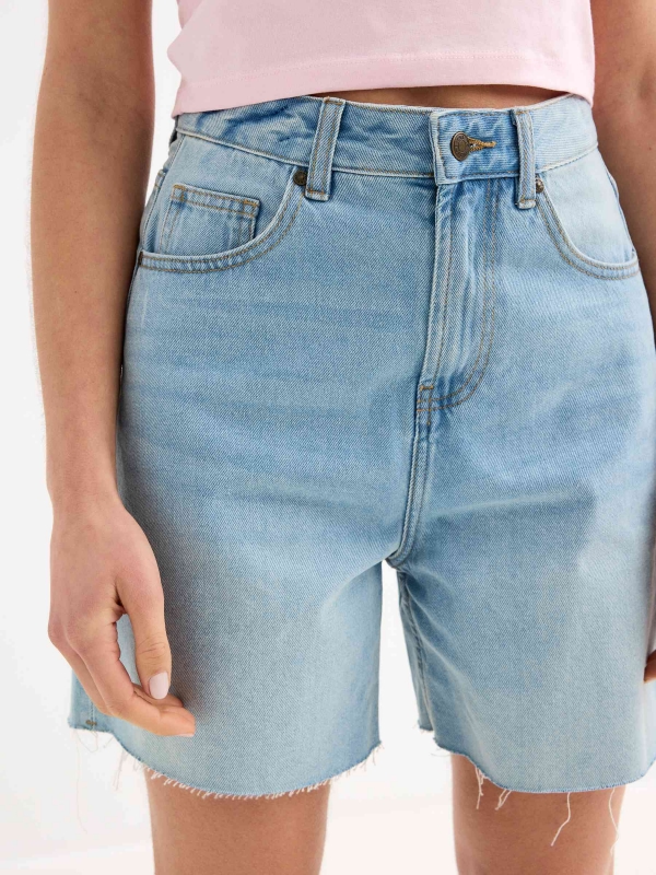 High-waisted denim shorts light blue front detail view