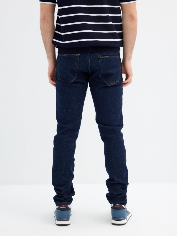 Dark blue slim jeans blue middle back view