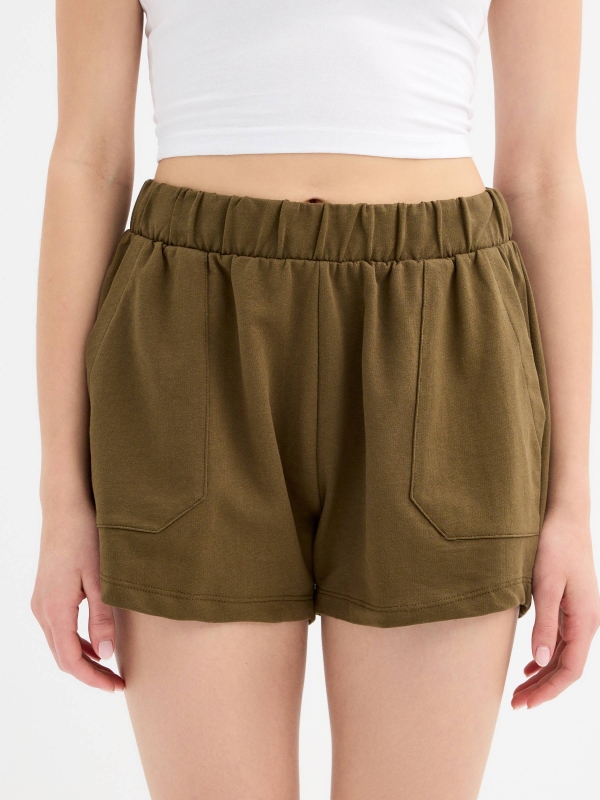 Elastic waist shorts with pockets olive green front detail view