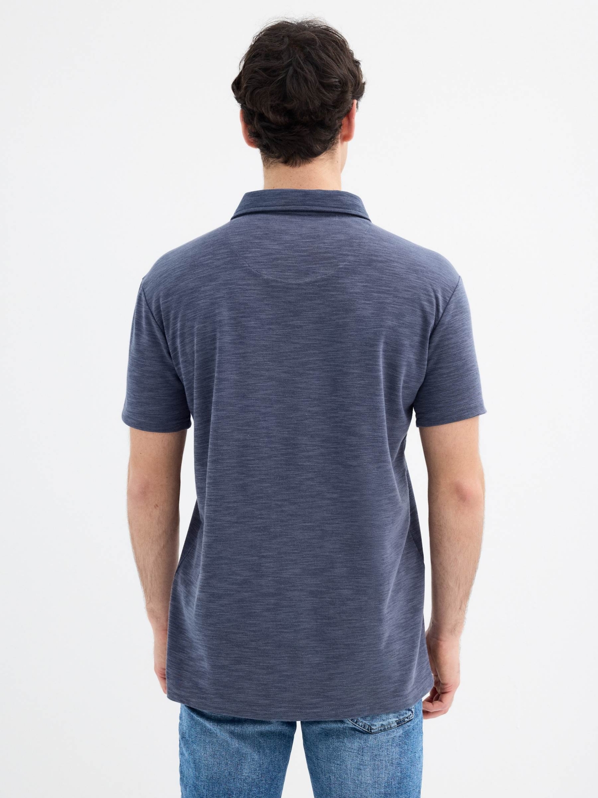 Short sleeve polo with button pocket navy middle back view