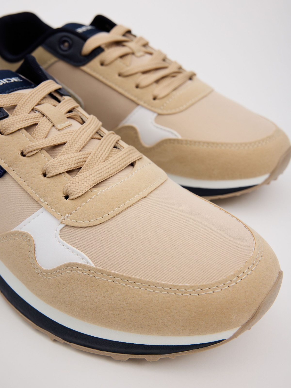 Casual low sneakers sand sand detail view