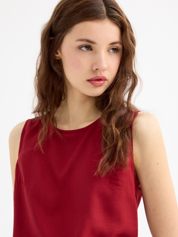 Sleeveless brick blouse brick red detail view