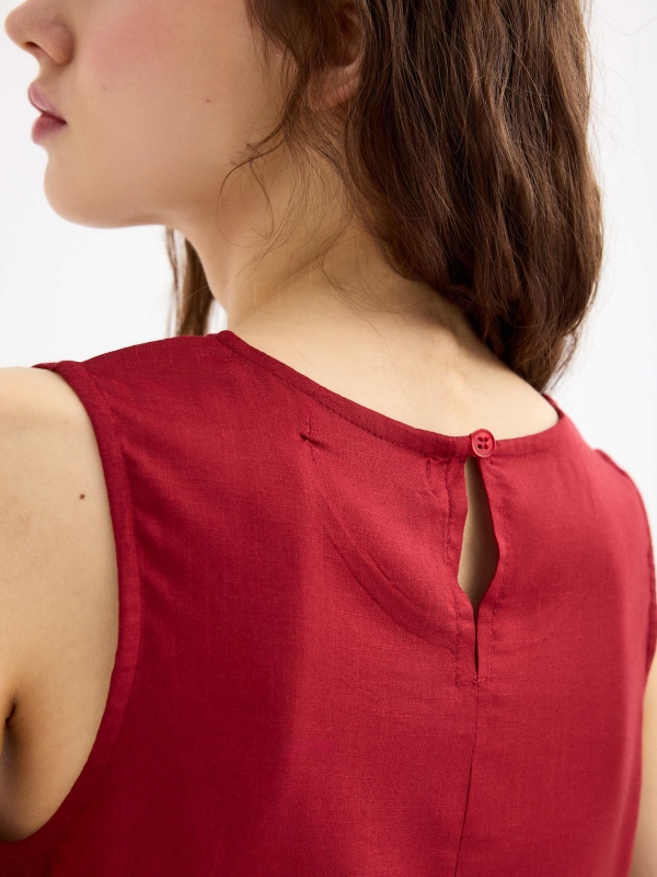 Sleeveless brick blouse brick red detail view