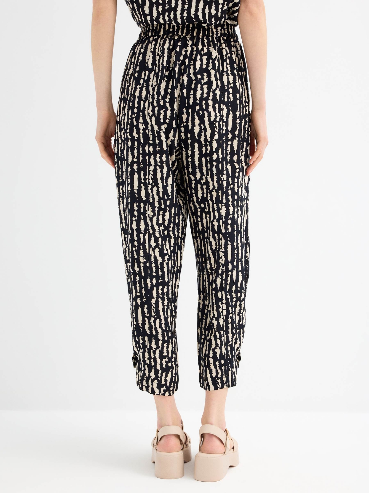 Printed fluid pants black middle back view