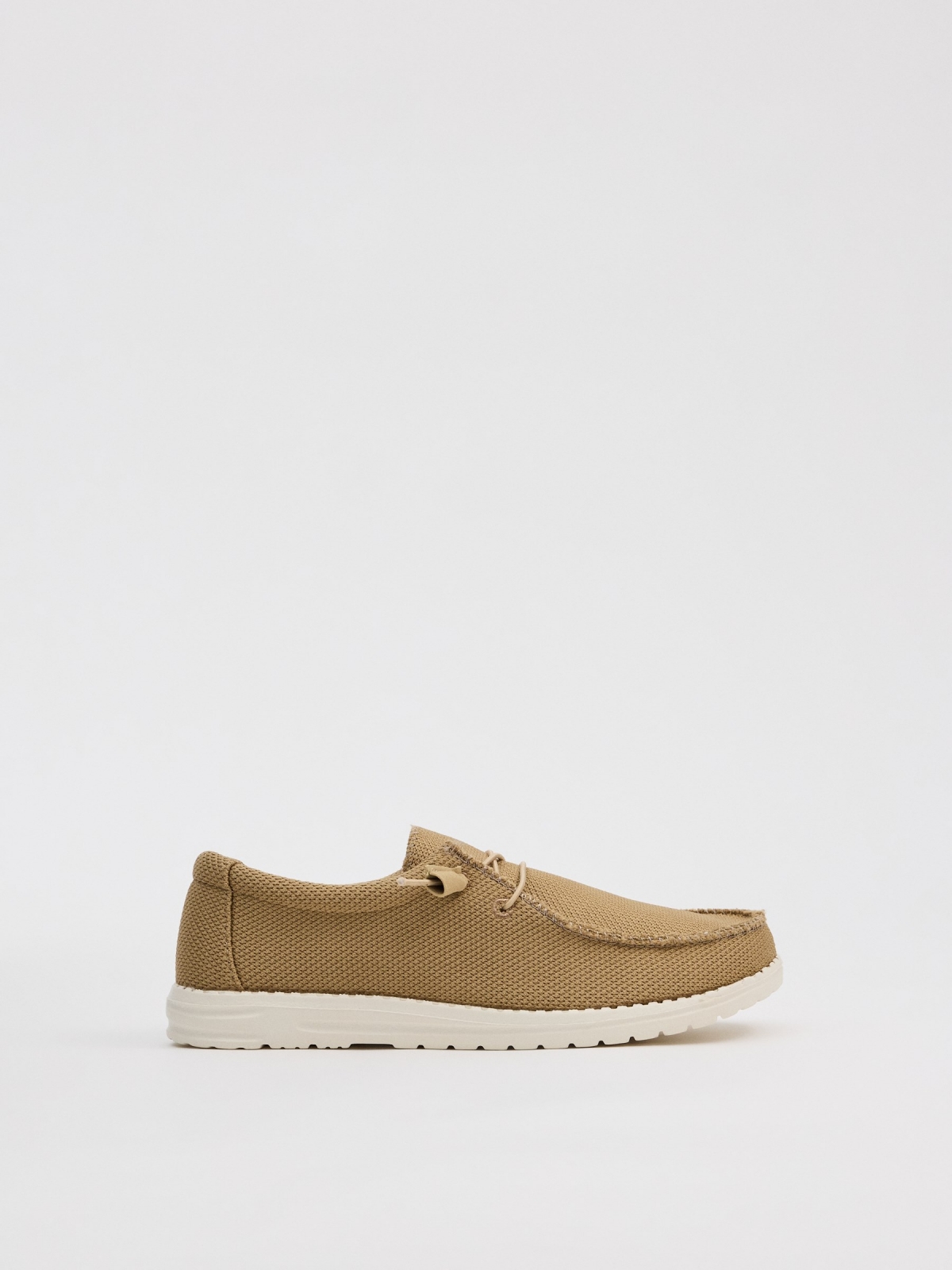 Light brown canvas wallaby shoe sand profile view