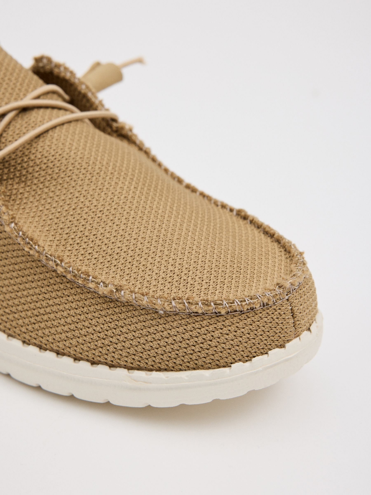 Light brown canvas wallaby shoe sand detail view