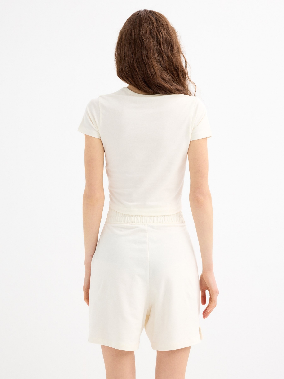 High-waisted plush Bermuda shorts off white middle back view