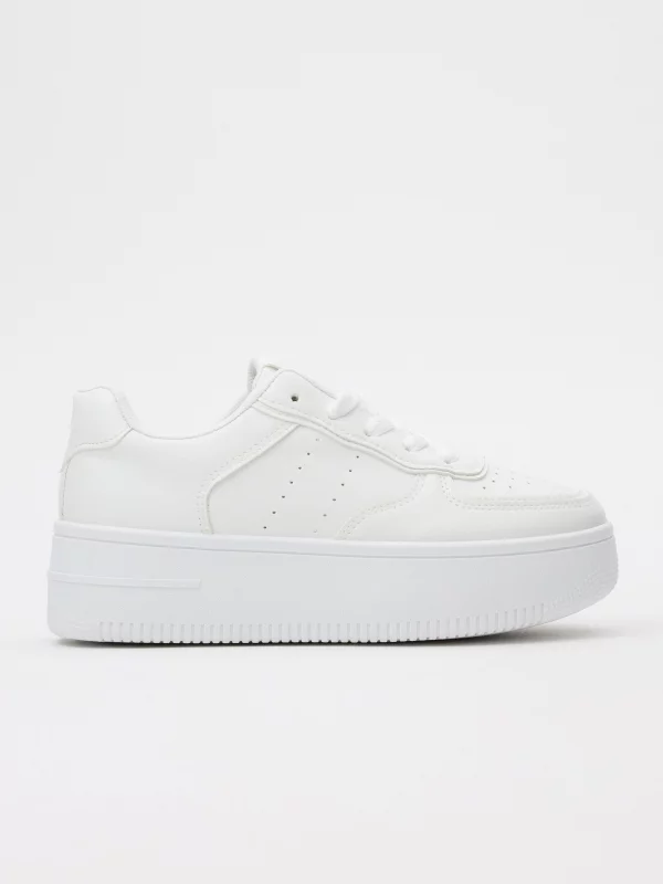 White platform low sneakers white profile view