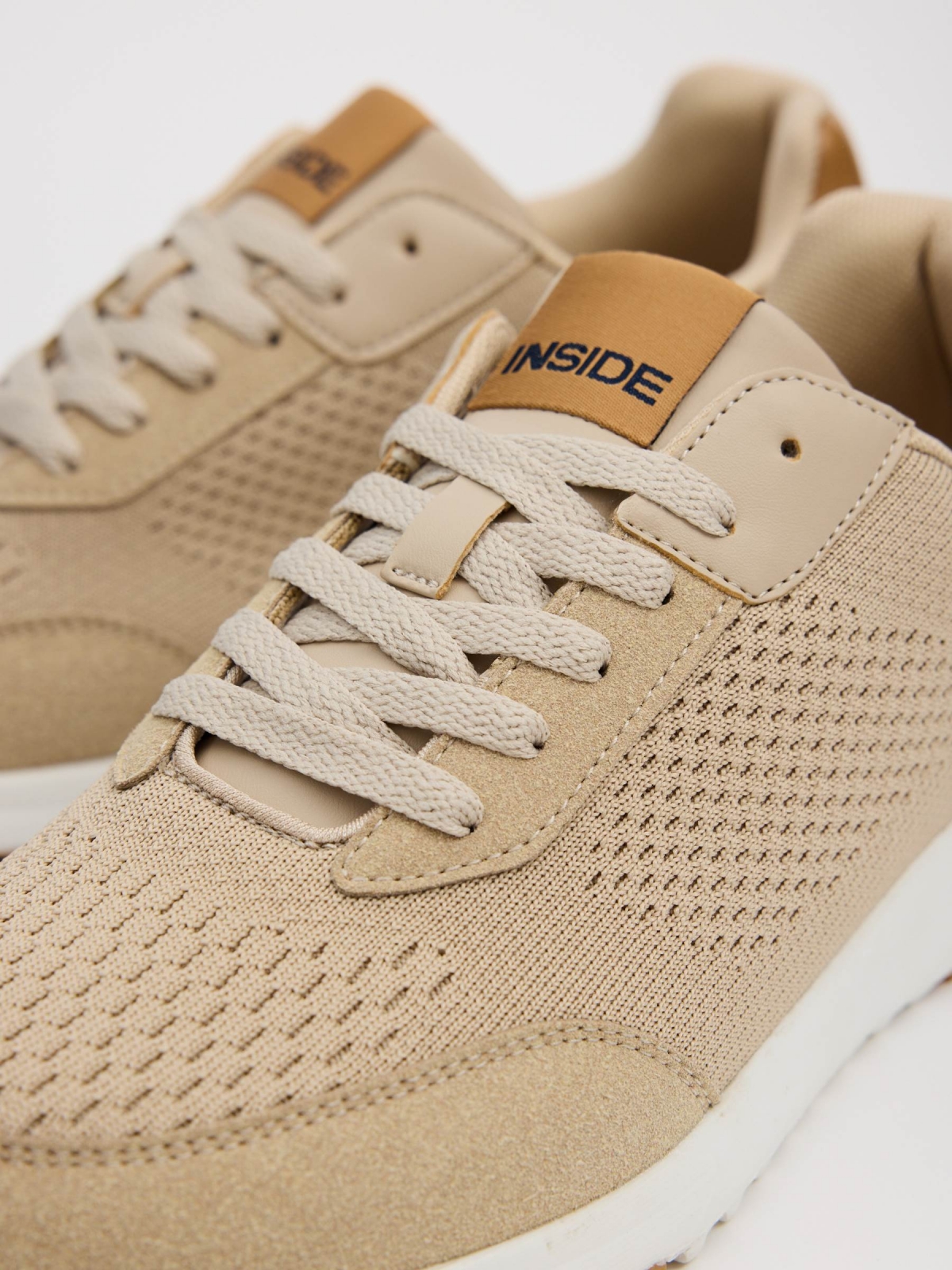 Beige casual running sneakers sand detail view