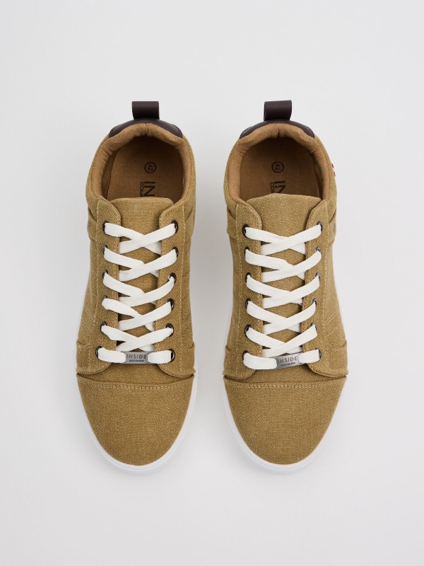 Canvas sneakers sand sand zenithal view