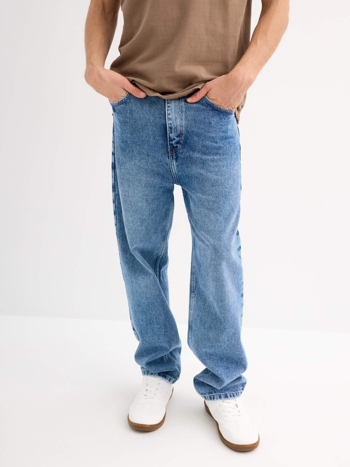 Blue baggy jeans with frayed blue middle front view