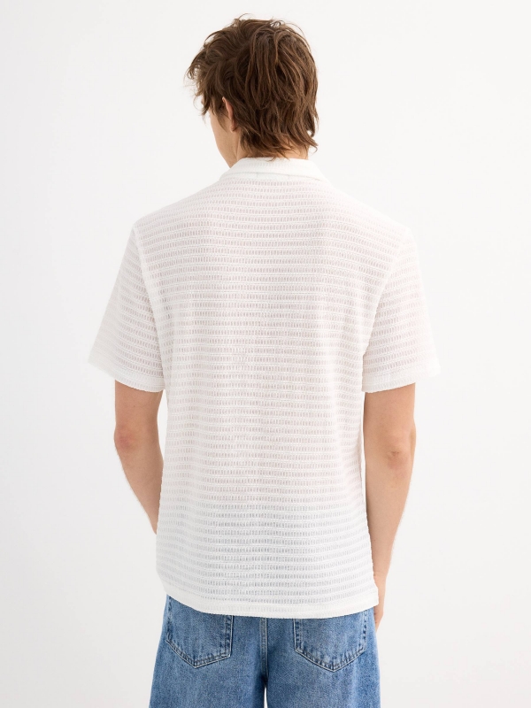 White short-sleeve knit shirt white middle back view