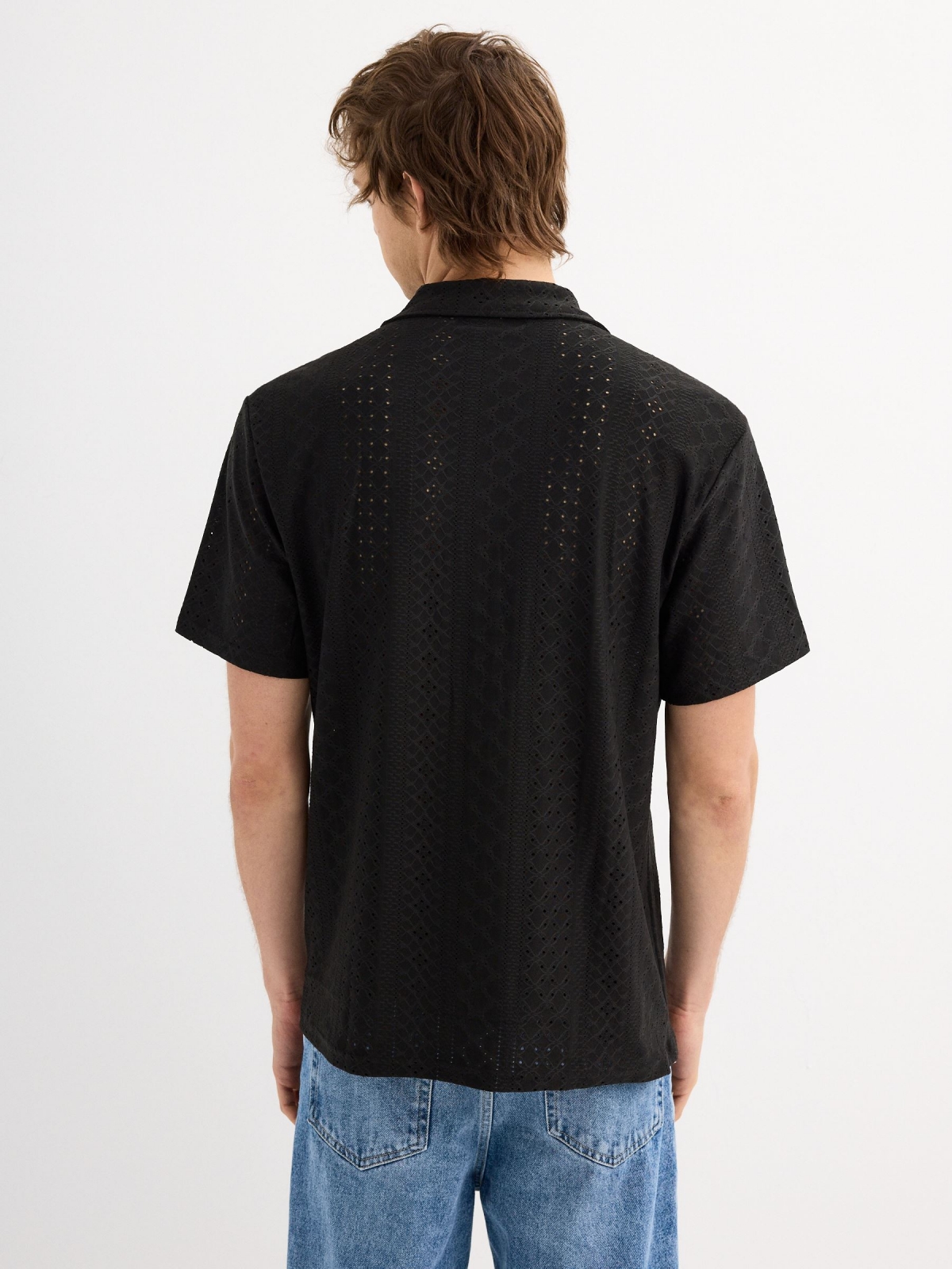 Short sleeve knit shirt black middle back view