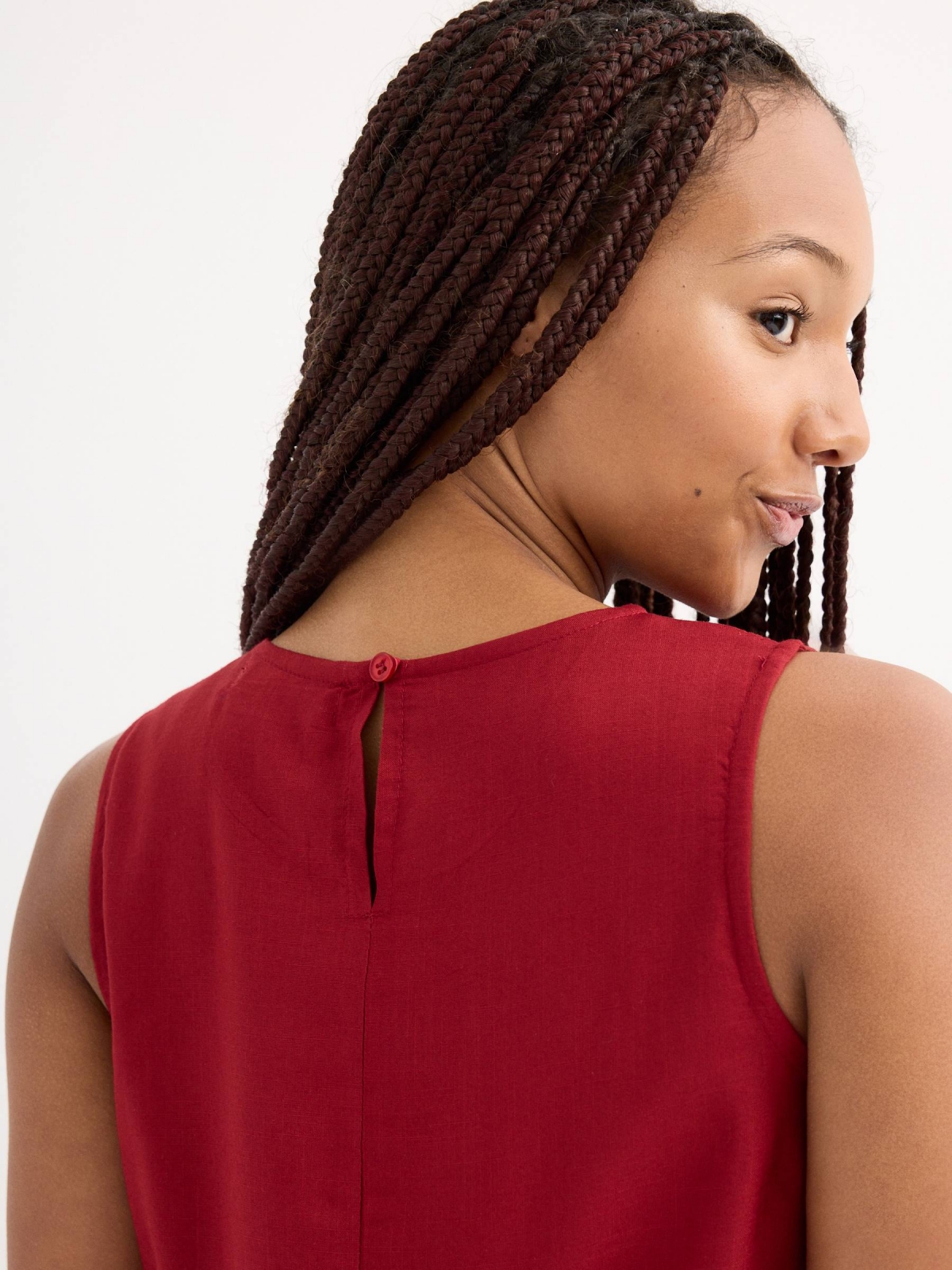 Sleeveless brick blouse brick red detail view