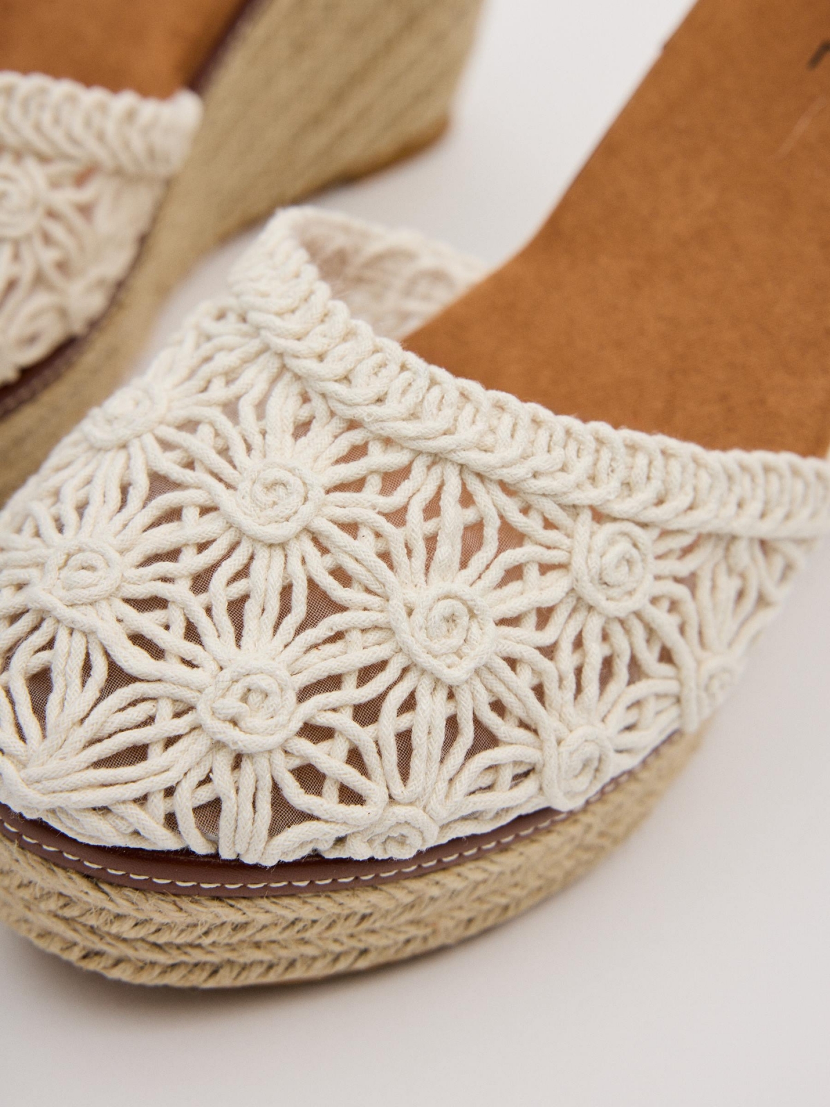 Closed-toe perforated wedges white detail view