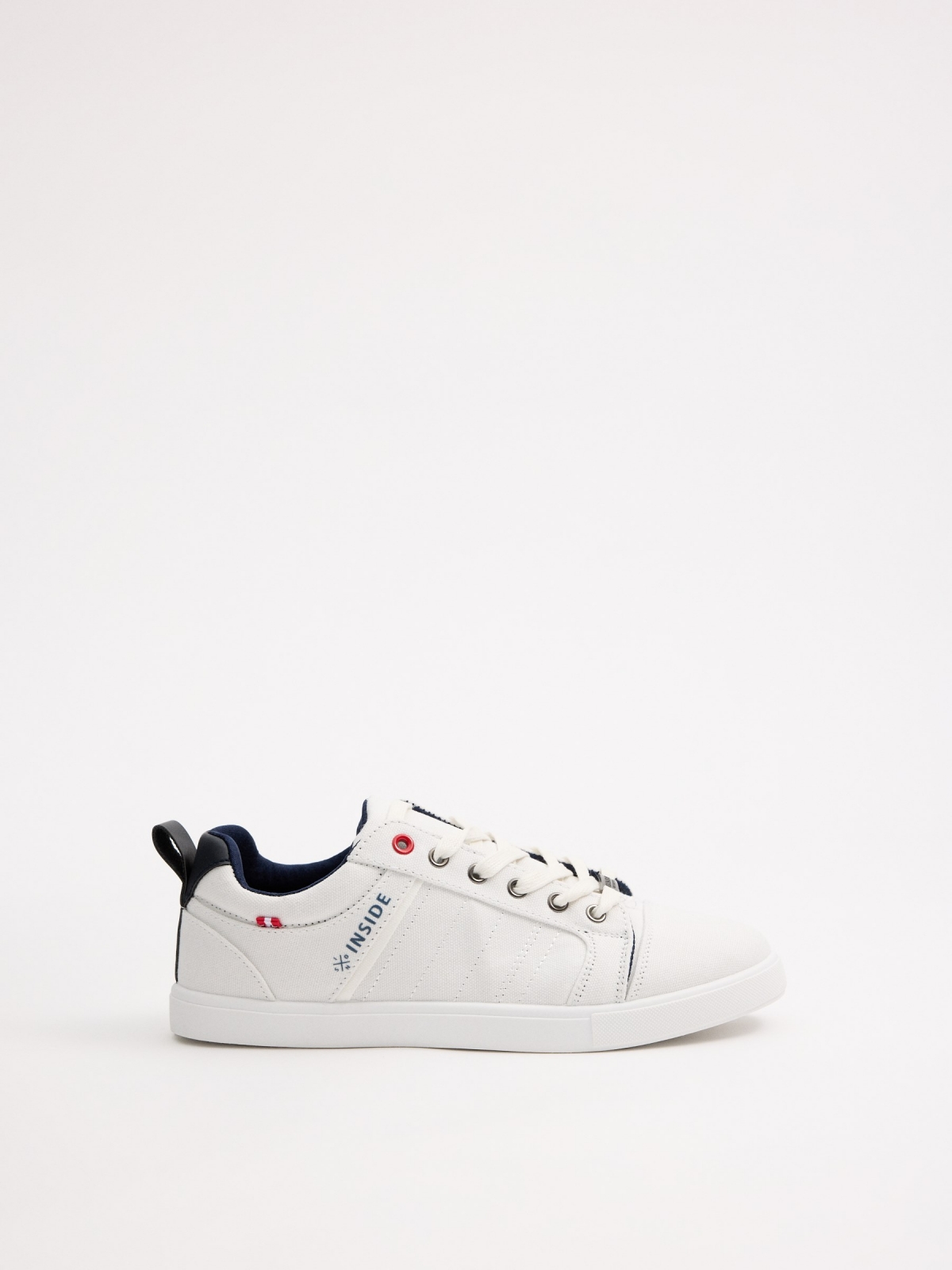 White canvas sneakers white profile view